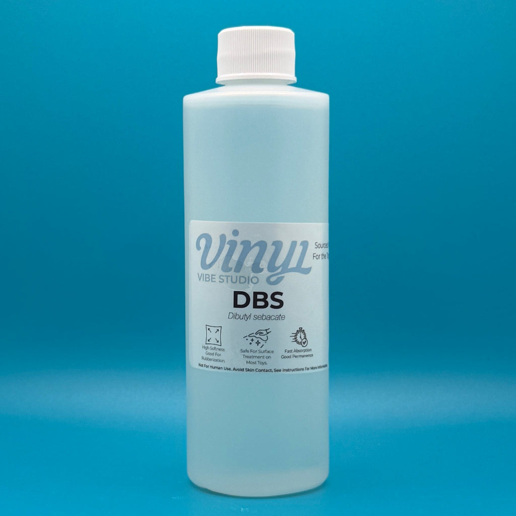 8 fl oz Bottle of DBS - PVC/ vinyl plasticizer & conditioner on a blue background
